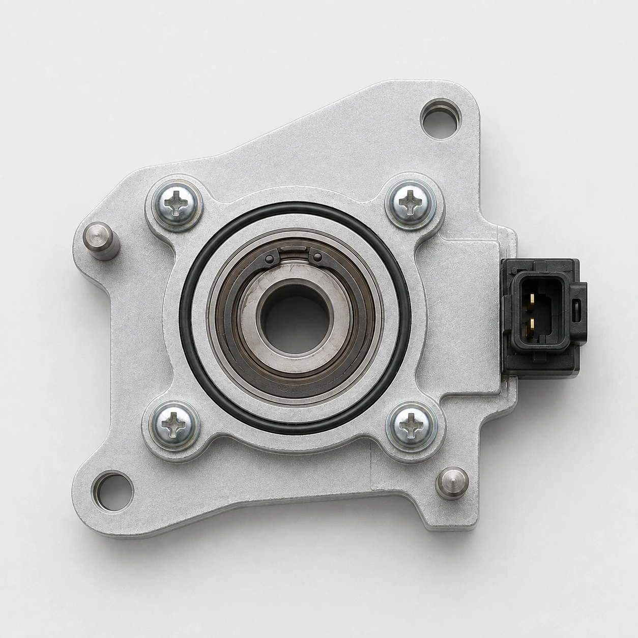 A top-down capture of an assembled fixture with fasteners, locating pins and a keyed connector.